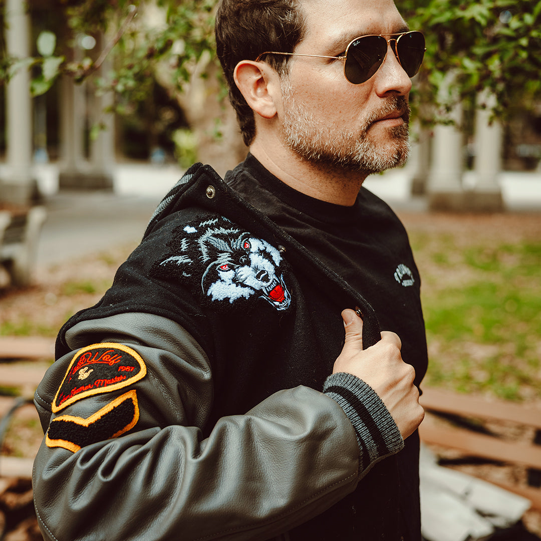 MIGHTY WOLVES VARSITY JACKET - BLACK